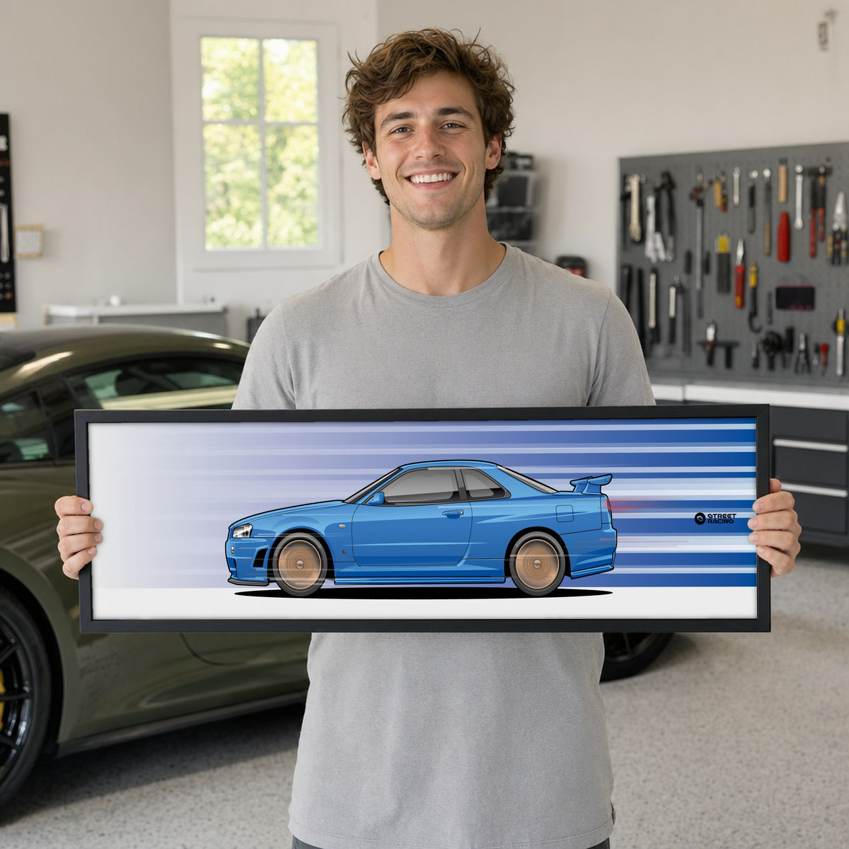 Cuadro arte en movimiento Nissan Skyline GT-R R34 color Bayside Blue en manos de una persona – StreetRacing