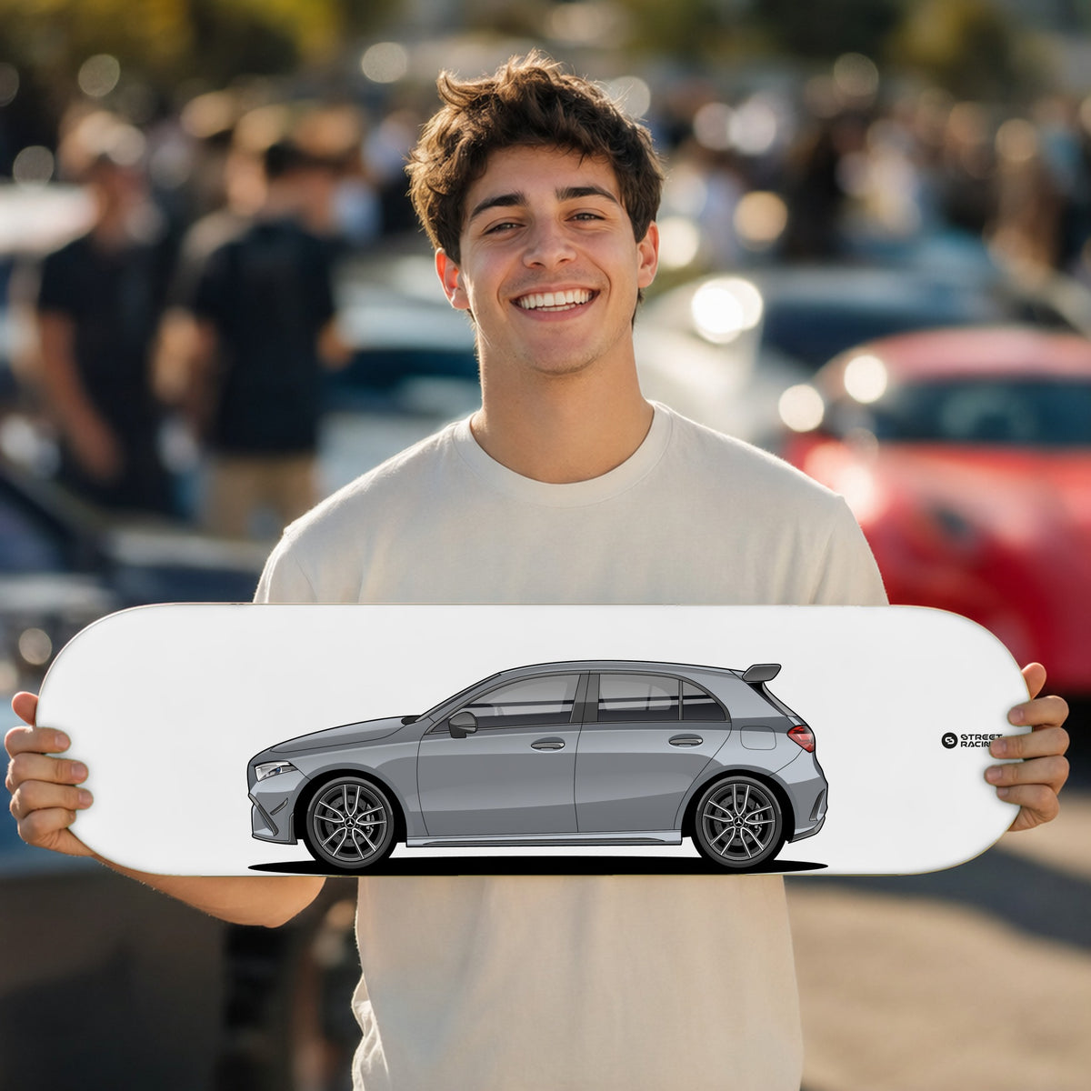 Tabla decorativa skate Mercedes-AMG A 35 2026 Mountain Grey fondo Plano en un car meet – StreetRacing