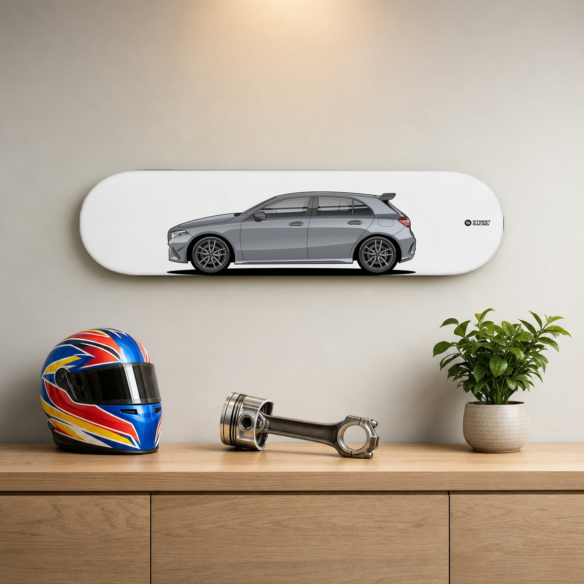 Tabla decorativa skate Mercedes-AMG A 35 2026 Mountain Grey fondo Plano en un living – StreetRacing