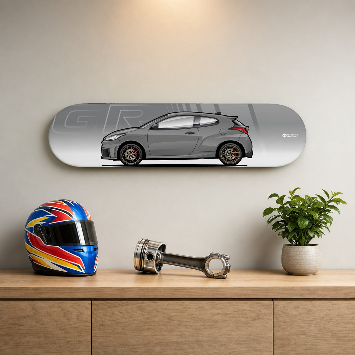 Tabla decorativa skate Toyota GR Yaris Gris oscuro fondo GR en un living – StreetRacing